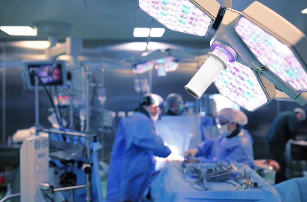 Surgeons performing a procedure in a surgical room.